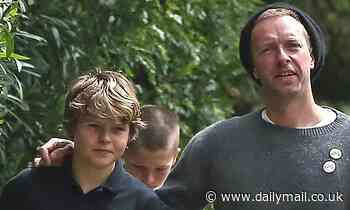 Chris Martin bonds with birthday boy Moses, 14, on stroll