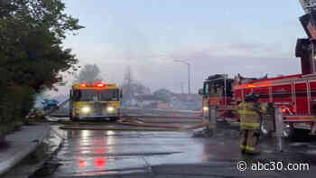Road closed as firefighters battle house fire in Atwater