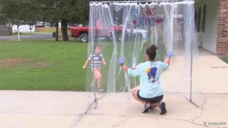 ‘Hug Curtain’ keeps family close during COVID-19 pandemic