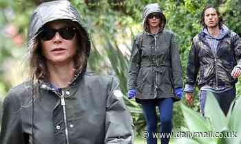 Gywneth Palrow looks gloomy on rainy stroll with husband Brad Falchuk after admitting to tensions