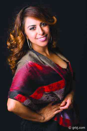 Photo entrepreneur looks to the future with loan - grbj.com