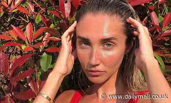 Megan McKenna sizzles in a daring red swimsuit as she goes make-up free