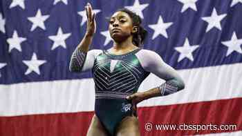 WATCH: Simone Biles shows off incredible balance by taking off sweatpants in 'handstand challenge'