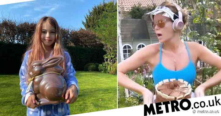 Amanda Holden works out with an Easter cake as she continues to entertain from lockdown