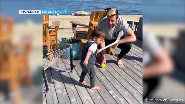 Flame Milan Lucic wants games to resume, but until then spends time with his kids