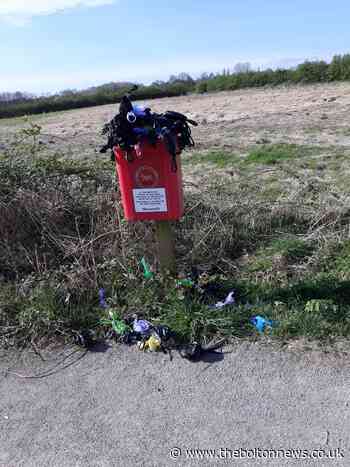 Bags of dog poo left on closed bin at Cutacre Country Park