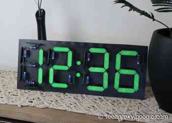 Ectromechanical Arduino clock built using 28 servos