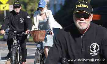 Arnold Schwarzenegger, 72, grabs a breath of fresh air on bike ride with Heather Milligan, 45