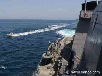 Photos show nearly a dozen Iranian attack boats harassing US Navy and Coast Guard ships in 'dangerous' exchange