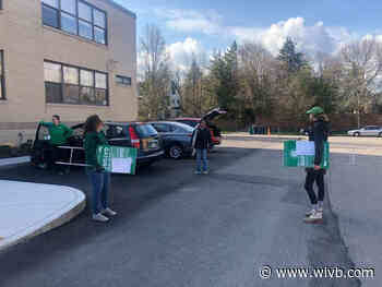 Nardin Academy faculty and staff members surprise seniors with signs to honor them