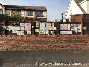 Teacher transforms her fence into community art wall and people are loving it