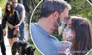 Ben Affleck wraps his arms around his girlfriend Ana de Armas as they take their dogs for a walk