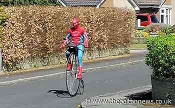 Spider-Man spotted riding a penny-farthing in Bolton - The Bolton News