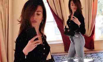 Michelle Keegan showcases her pert posterior in mom jeans as she shares throwback snap
