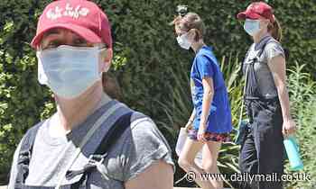 Alyson Hannigan makes sure to protect herself with a face mask during walk with her daughter