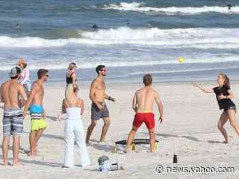 Hundreds crowd newly reopened Florida beaches even as the state sees a spike in coronavirus infections