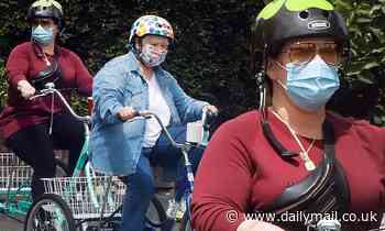 Melissa McCarthy and mother Sandy get some exercise on adult tricycles