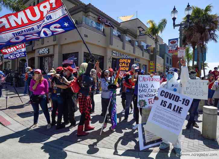 Man arrested on suspicion of threatening cameraman after Huntington Beach rally