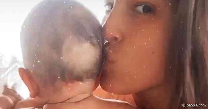 Ashley Graham Sweetly Smooches Son Isaac in Cheeky Video