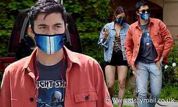 Henry Golding looks dapper as he takes his dog for a walk during quarantine break with wife Liv Lo