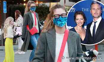Scream 2 vet Rebecca Gayheart wears a mask after buying a cute pink toy for her daughter