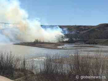 Crews battle wildfire in Lethbridge river valley