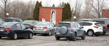 Catholics pray in cars for pandemic's end