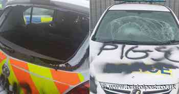 Windows smashed and graffiti sprayed on police car
