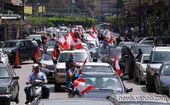 Lebanese protesters return to streets in car convoys amid coronavirus lockdown