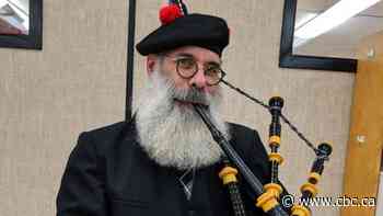 Bagpiper plays nightly streetside serenade to lift spirits, cure cabin fever
