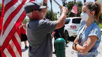 'It was heated': ICU nurse who silently stood against protesters speaks out