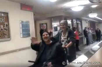 Hospital staff cheer recovery of ventilated COVID patient