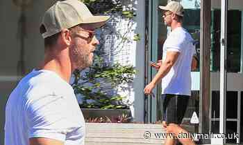 Chris Hemsworth flaunts his muscular physique in a tight T-shirt in Byron Bay - Daily Mail