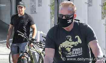 Arnold Schwarzenegger wears Terminator-inspired face mask on bike ride with Joseph Baena