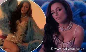 Cher Lloyd embodies showgirl chic as she dons a plunging sequinned corset in her new music video