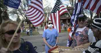 With honks, signs and flags, about 250 protest Walz's antivirus measures