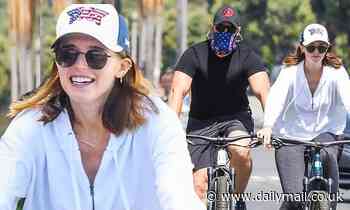 Katherine Schwarzenegger hides her baby bump during happy bike ride with Chris Pratt and dad Arnold