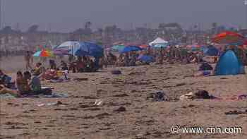 People crowd California beaches despite coronavirus concerns