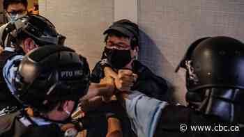 Hundreds in Hong Kong defy social distancing measures for pro-democracy protest