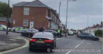 Live updates: Armed police swoop on street