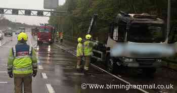 Firefighters tackle blaze after lorry bursts into flames on M42