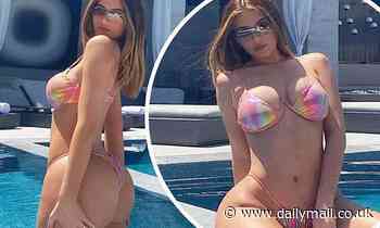 Kylie Jenner flaunts her pert derriere and her flat midriff in racy bikini snaps