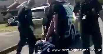 Moment police pepper spray thug after officer attacked in street clash