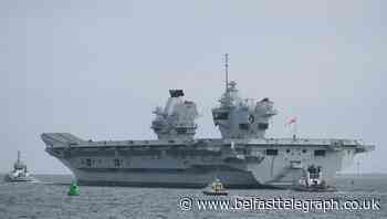 Navy aircraft carrier sets sail after crew tested for Covid-19
