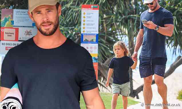 Hollywood megastar Chris Hemsworth is every inch the doting dad with son at beach - Daily Mail