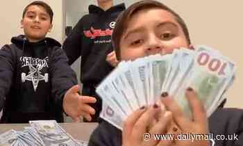 Mason Disick, 10, seen in resurfaced TikTok video dancing with a wad of 100 dollar bills