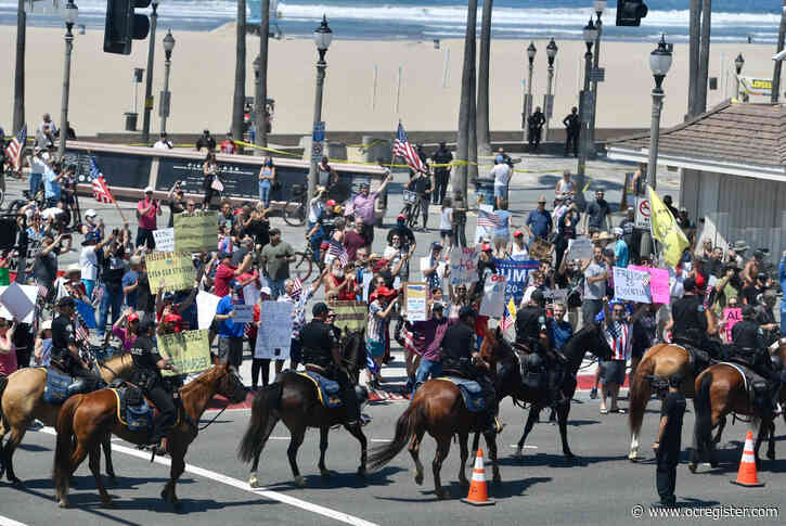 Protesters flock to Huntington Beach following state-ordered OC beach closures