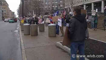Protest against PAUSE order held outside Rath Building