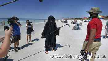 Florida lawyer dresses as grim reaper on beach in protest at reopening