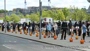 In Pictures: Beaches quiet but queues snake across Britain in lockdown